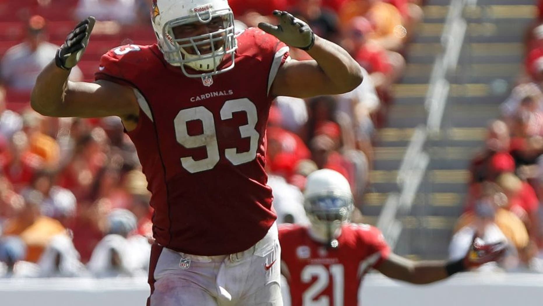 Sep 29, 2013; Tampa, FL, USA; Arizona Cardinals defensive end Calais Campbell (93) and cornerback Patrick Peterson (21) reacts against the Tampa Bay Buccaneers during the second half at Raymond James Stadium. Arizona Cardinals defeated the Tampa Bay Buccaneers 13-10. Mandatory Credit: Kim Klement-USA TODAY Sports