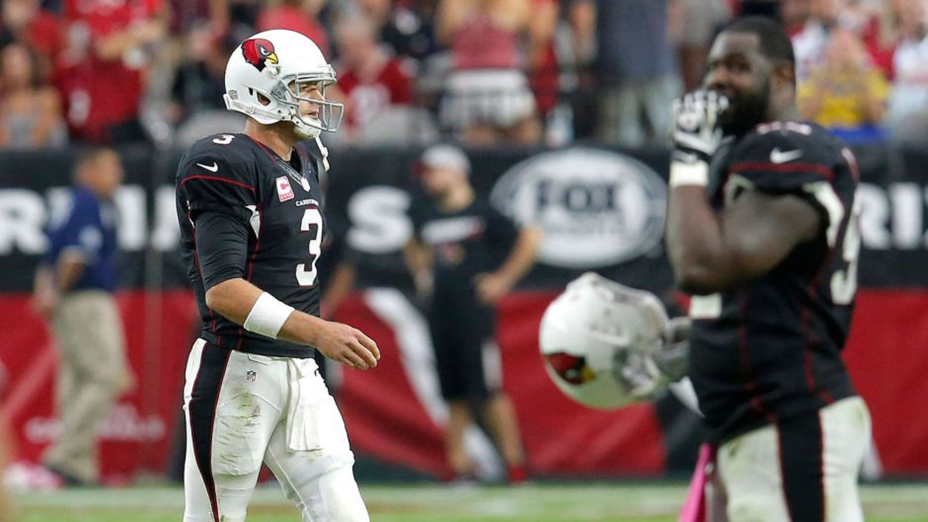 Arizona Cardinals quarterback Carson Palmer (3) walks off the field after an NFL football game against the St. Louis Rams, Sunday, Oct. 4, 2015, in Glendale, Ariz. The Rams won 24-22. (AP Photo/Rick Scuteri)