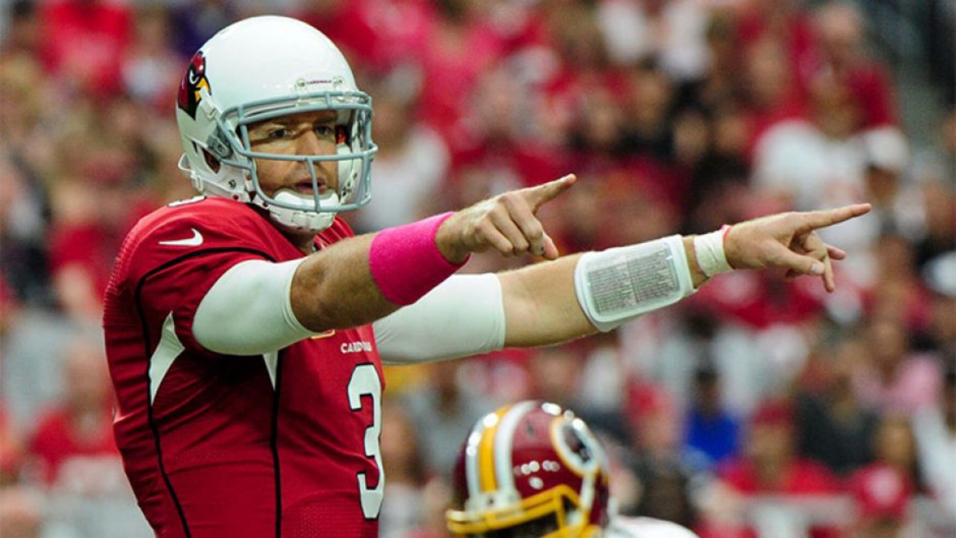 Oct 12, 2014; Glendale, AZ, USA; Arizona Cardinals quarterback Carson Palmer (3) signals to teammates during the first half against the Washington Redskins at University of Phoenix Stadium. Mandatory Credit: Matt Kartozian-USA TODAY Sports