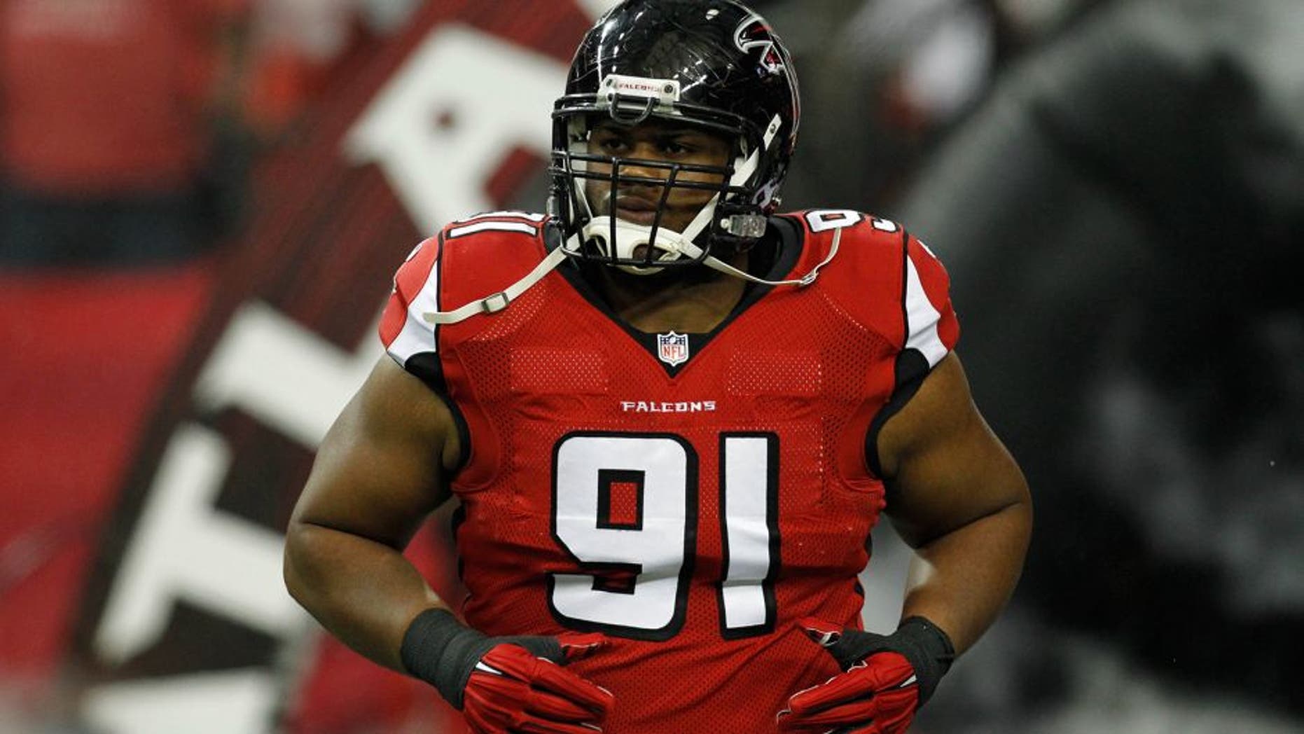 Nov 30, 2014; Atlanta, GA, USA; Atlanta Falcons defensive tackle Corey Peters (91) runs on the field before a game against the Arizona Cardinals at the Georgia Dome. Mandatory Credit: Brett Davis-USA TODAY Sports