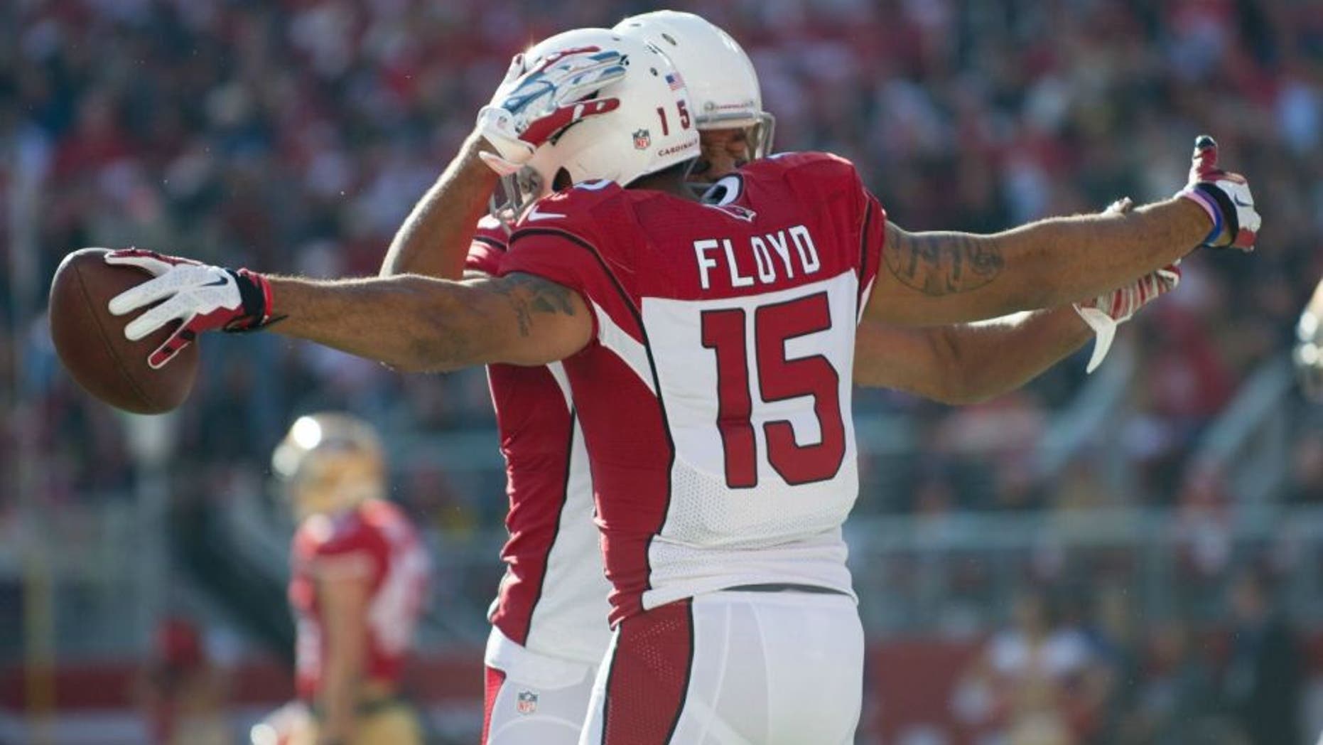 Dec 28, 2014; Santa Clara, CA, USA; Arizona Cardinals wide receiver Michael Floyd (15) celebrates with wide receiver Larry Fitzgerald (11) after scoring a touchdown during the first quarter against the San Francisco 49ers at Levi's Stadium. The against the San Francisco 49ers defeated the Arizona Cardinals 20-17. Mandatory Credit: Ed Szczepanski-USA TODAY Sports