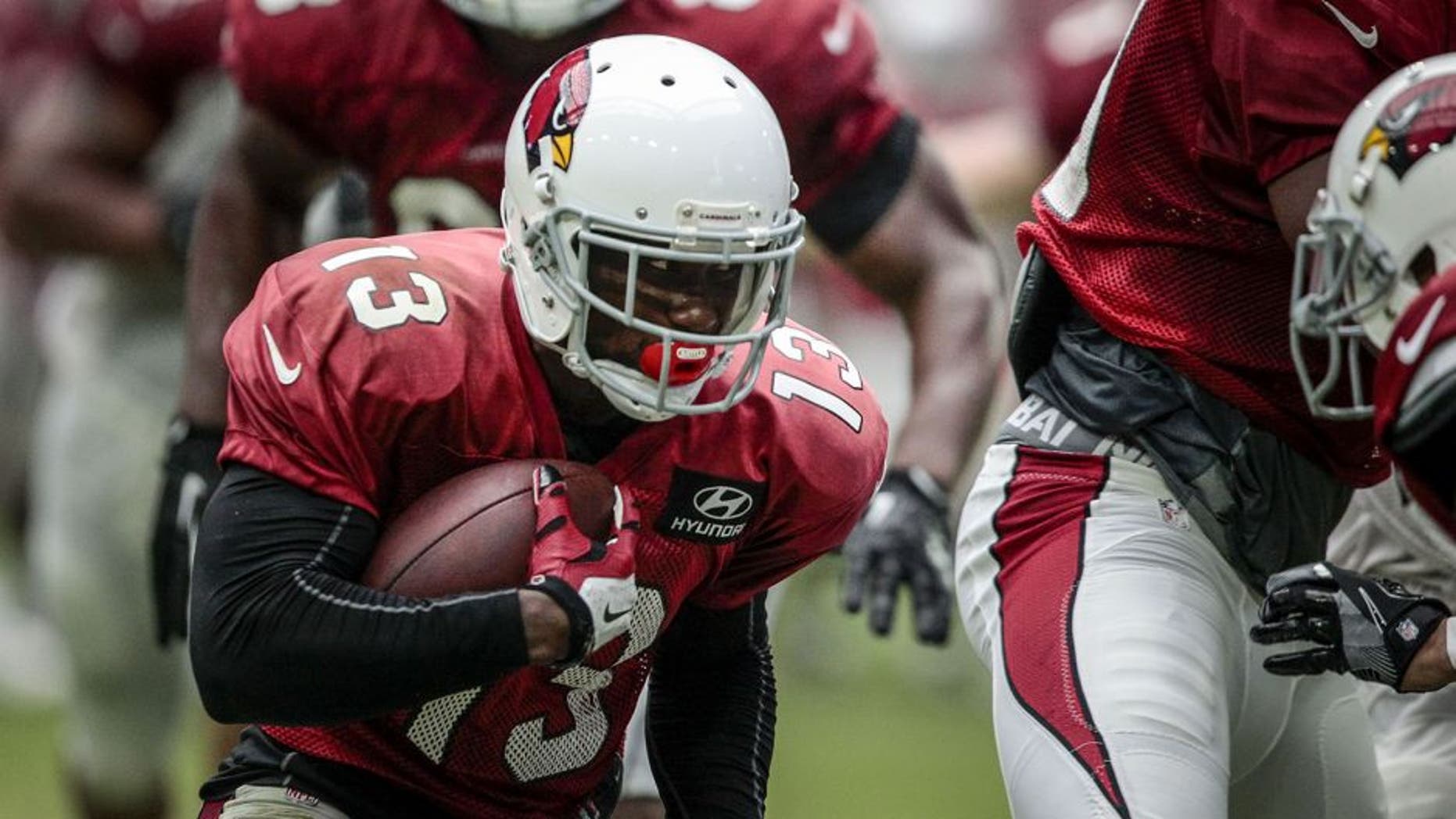 July 31, 2016; Glendale, AZ, USA; Arizona Cardinals wide receiver Jaron Brown (13) runs with the ball during training camp at University of Phoenix Stadium. Mandatory Credit: Charlie Kaijo/The Arizona Republic via USA TODAY NETWORK