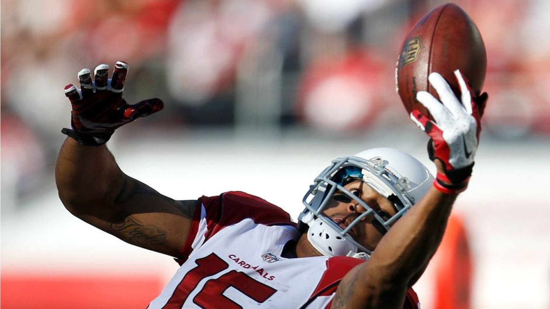 Arizona Cardinals wide receiver Michael Floyd (15) catches a pass against the San Francisco 49ers during the first half of an NFL football game in Santa Clara, Calif., Sunday, Dec. 28, 2014. (AP Photo/Tony Avelar)