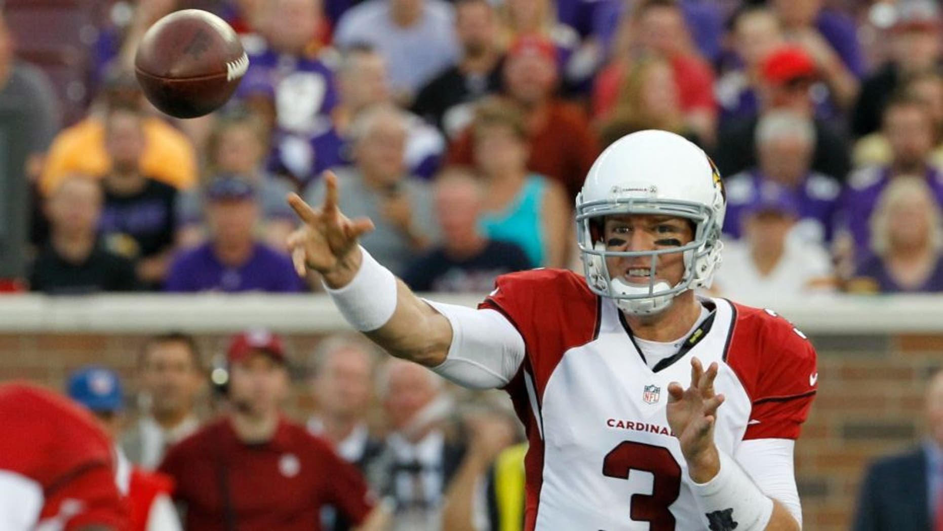 Arizona Cardinals quarterback Carson Palmer throws a pass during the first half of an NFL preseason football game against the Minnesota Vikings, Saturday, Aug. 16, 2014, in Minneapolis. (AP Photo/Ann Heisenfelt)