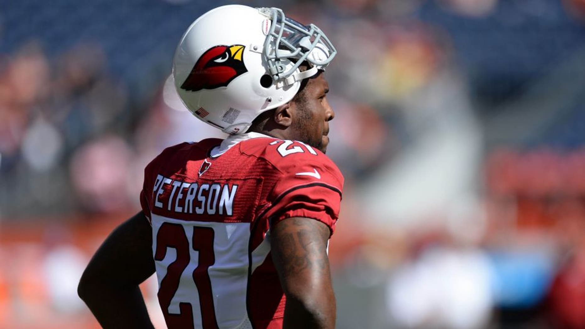 Oct 5, 2014; Denver, CO, USA; Arizona Cardinals cornerback Patrick Peterson (21) before the start of the game against the Denver Broncos at Sports Authority Field at Mile High. Mandatory Credit: Ron Chenoy-USA TODAY Sports