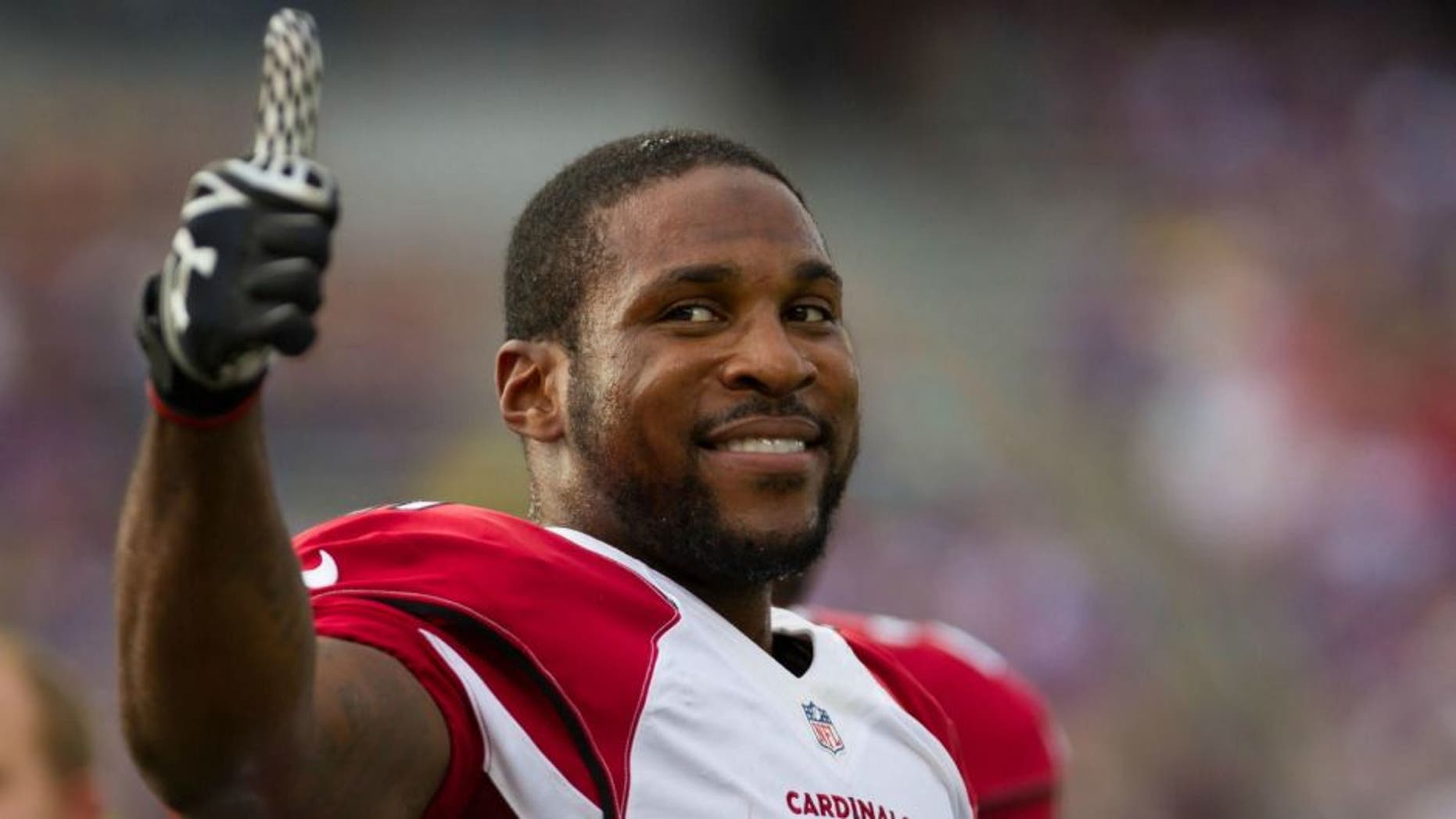 Aug 16, 2014; Minneapolis, MN, USA; Arizona Cardinals cornerback Patrick Peterson (21) smiles to the crowd prior to the game against the Minnesota Vikings at TCF Bank Stadium. Mandatory Credit: Brad Rempel-USA TODAY Sports