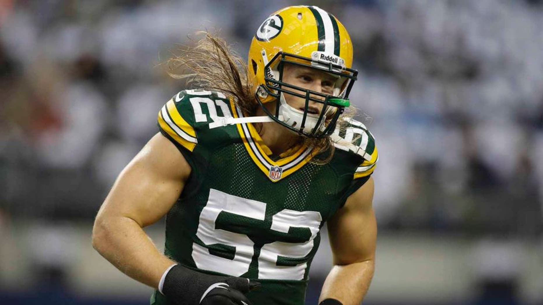 Dec 15, 2013; Arlington, TX, USA; Green Bay Packers outside linebacker Clay Matthews (52) on the field before the game against the Dallas Cowboys at AT&T Stadium. Mandatory Credit: Tim Heitman-USA TODAY Sports