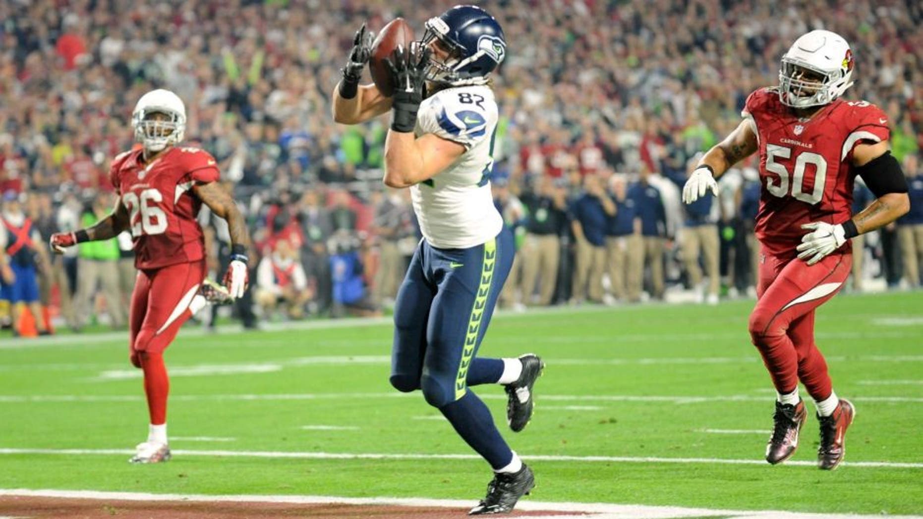 Dec 21, 2014; Glendale, AZ, USA; Seattle Seahawks tight end Luke Willson (82) catches a touchdown pass against the Arizona Cardinals during the second half at University of Phoenix Stadium. Mandatory Credit: Joe Camporeale-USA TODAY Sports
