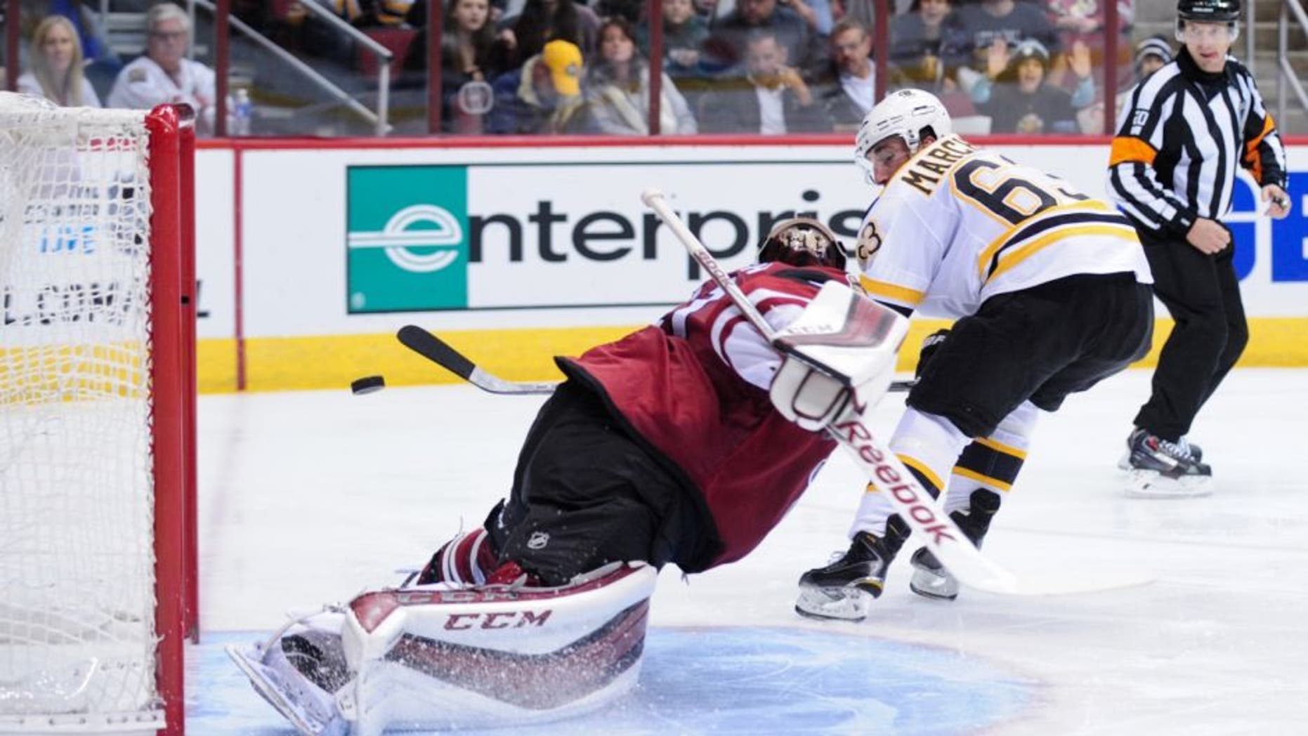 Oct 17, 2015; Glendale, AZ, USA; Boston Bruins left wing Brad Marchand (63) scores on Arizona Coyotes goalie Mike Smith (41) during the third period at Gila River Arena. Mandatory Credit: Matt Kartozian-USA TODAY Sports