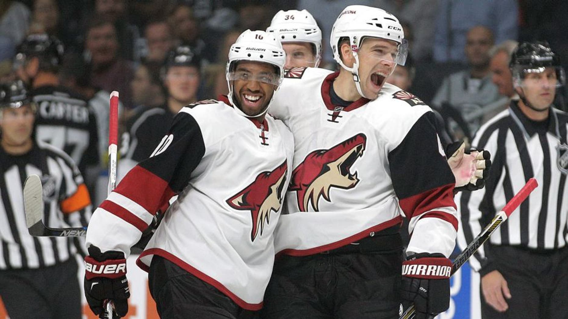 Arizona Coyotes' Zbynek Michalek, right, of the Czech Republic, celebrates his goal with teammate Anthony Duclair during the first period of an NHL hockey game against the Los Angeles Kings, Friday, Oct. 9, 2015, in Los Angeles. (AP Photo/Jae C. Hong)