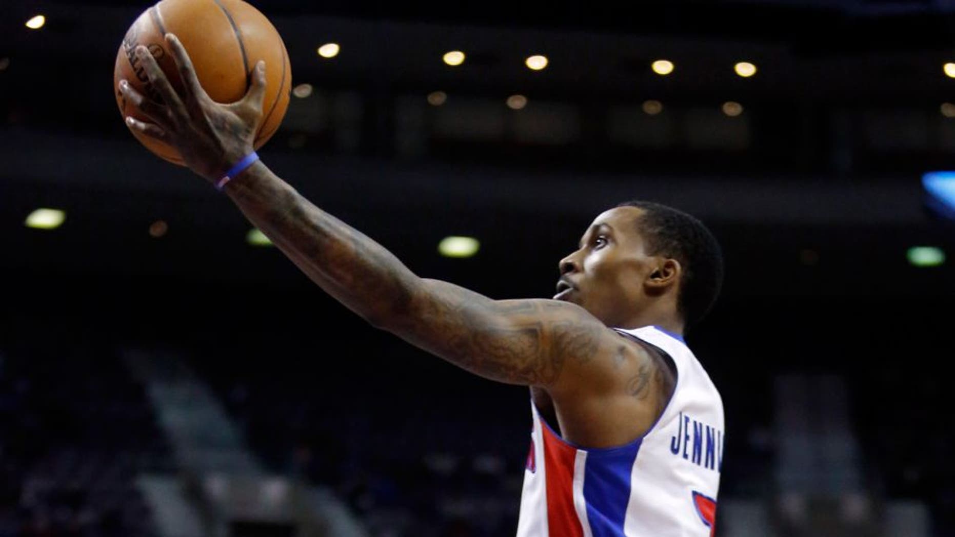 Detroit Pistons guard Brandon Jennings (7) lays up the ball against Brooklyn Nets forward Mason Plumlee (1) during the first half of an NBA basketball game on Friday, Feb. 7, 2014, in Auburn Hills, Mich. Jennings led all players with 26 points in the Pistons' 111-95 win. (AP Photo/Duane Burleson)
