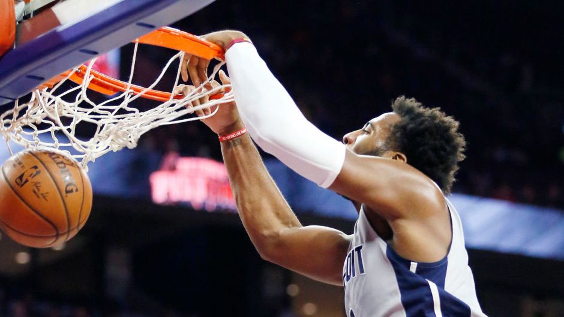 Detroit Pistonsâ Andre Drummond dunks over Chicago Bulls' E'Twaun Moore (55) during the first half of an NBA basketball game Friday, Oct. 30, 2015, in Auburn Hills, Mich. (AP Photo/Duane Burleson)
