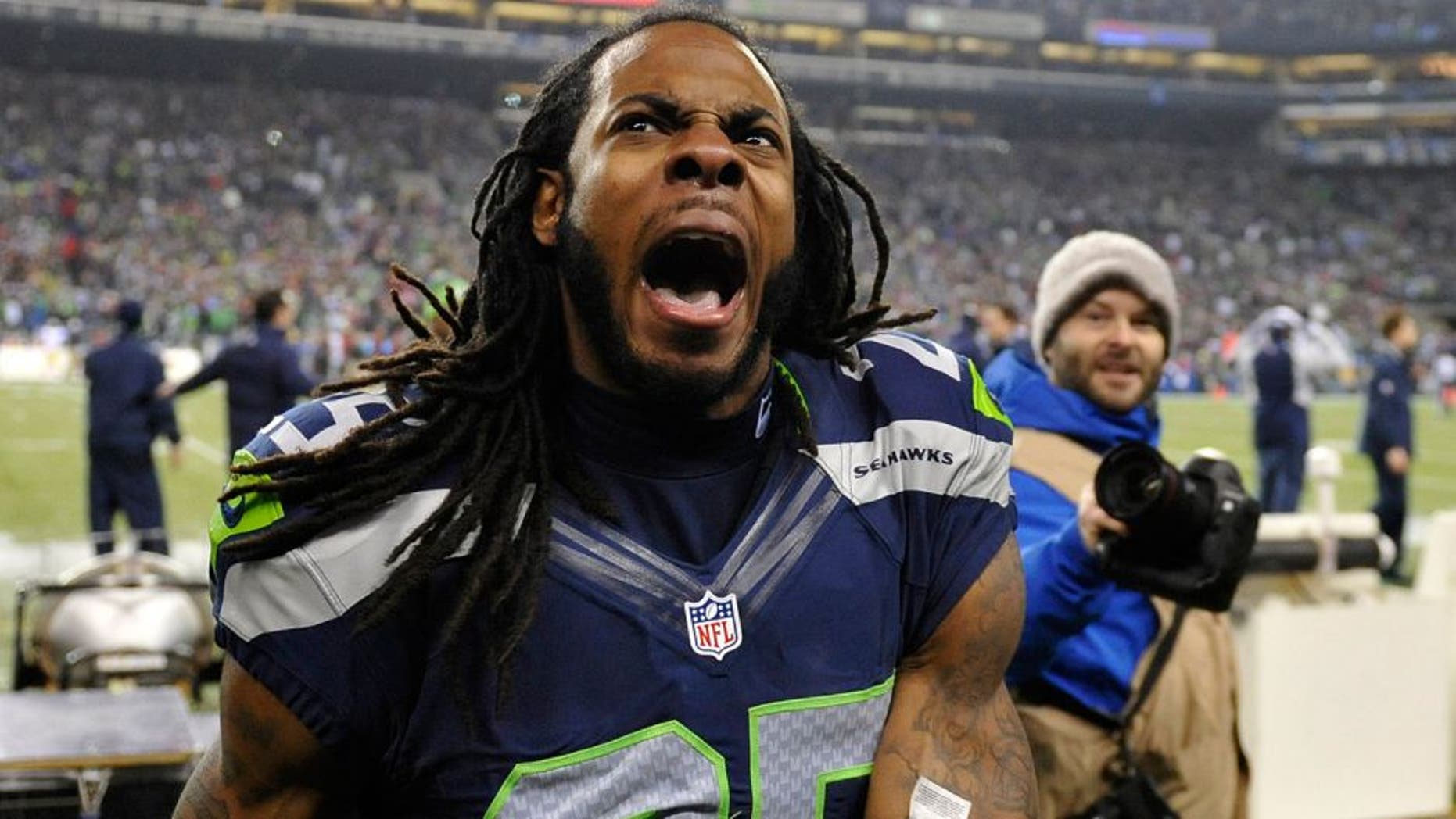 Jan 19, 2014; Seattle, WA, USA; Seattle Seahawks cornerback Richard Sherman (25) celebrates after defeating the San Francisco 49ers in the 2013 NFC Championship football game at CenturyLink Field. Mandatory Credit: Steven Bisig-USA TODAY Sports