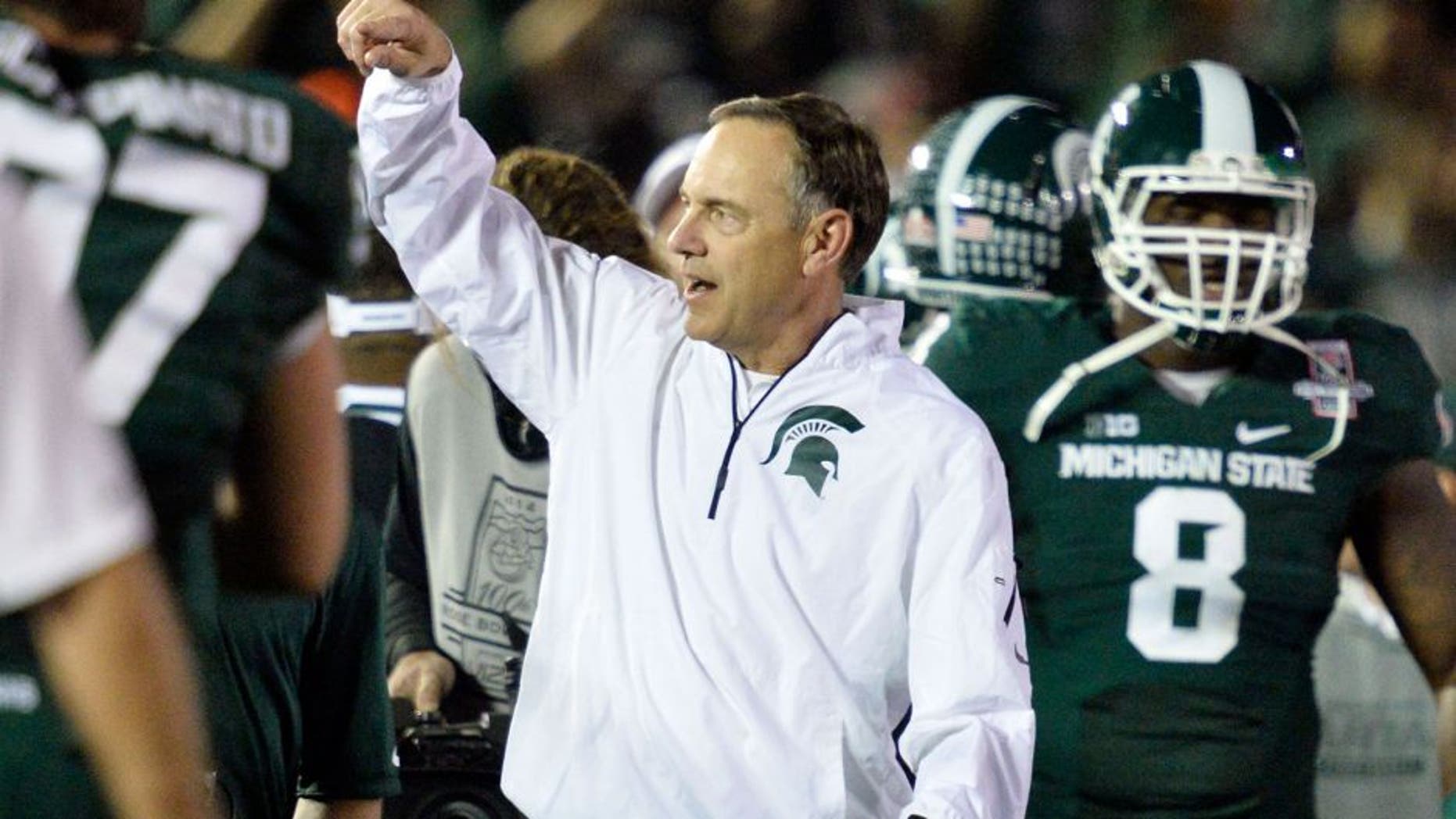 Jan 1, 2014; Pasadena, CA, USA; Michigan State Spartans head coach Mark Dantonio celebrates after Michigan State Spartans beat Stanford Cardinal 24-20 at the Rose Bowl. Mandatory Credit: Robert Hanashiro-USA TODAY Sports