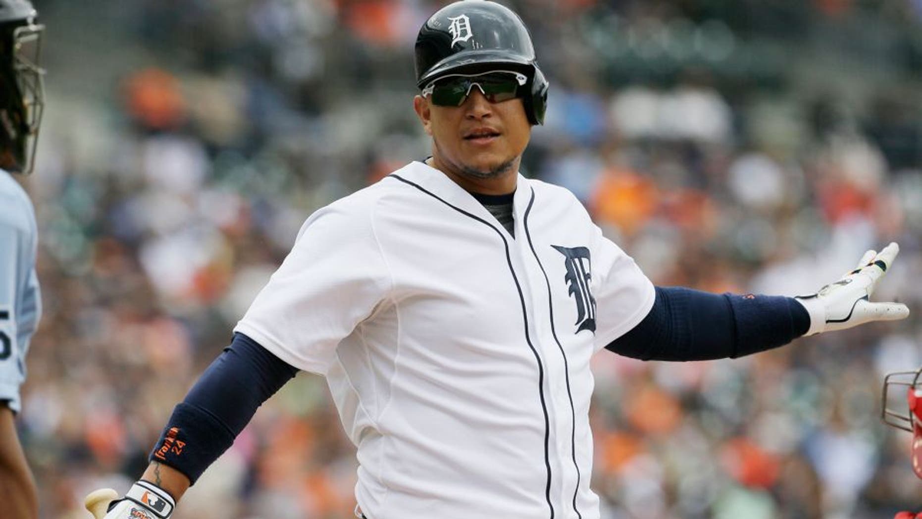 Detroit Tigers' Miguel Cabrera objects to a strike with umpire C.B. Bucknor during the seventh inning of a baseball game aLos Angeles Angels, Thursday, Aug. 27, 2015, in Detroit. (AP Photo/Carlos Osorio)