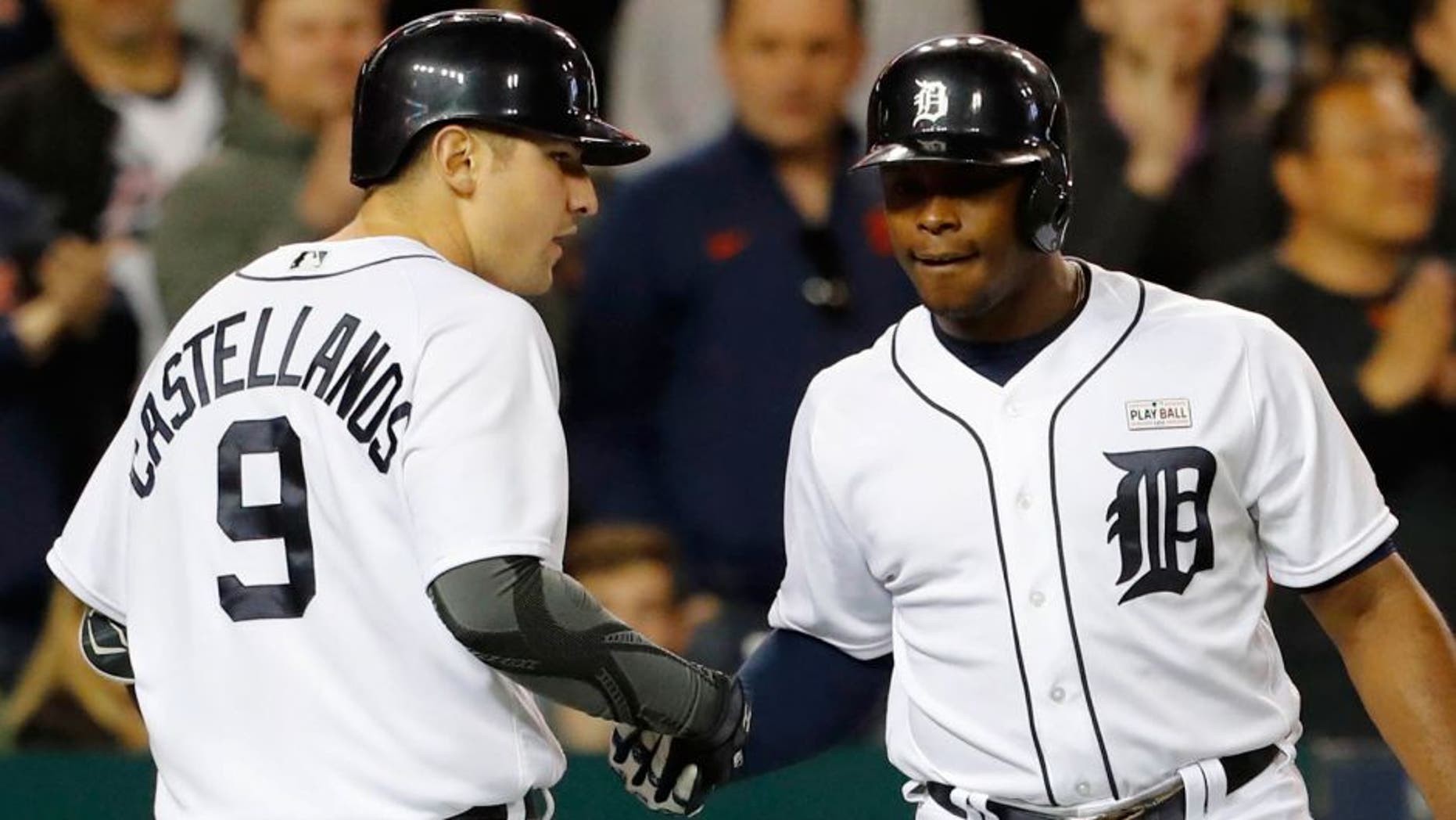 May 16, 2016; Detroit, MI, USA; Detroit Tigers third baseman Nick Castellanos (9) receives congratulations from left fielder Justin Upton (8) after he hits a home run in the seventh inning against the Minnesota Twins at Comerica Park. Mandatory Credit: Rick Osentoski-USA TODAY Sports