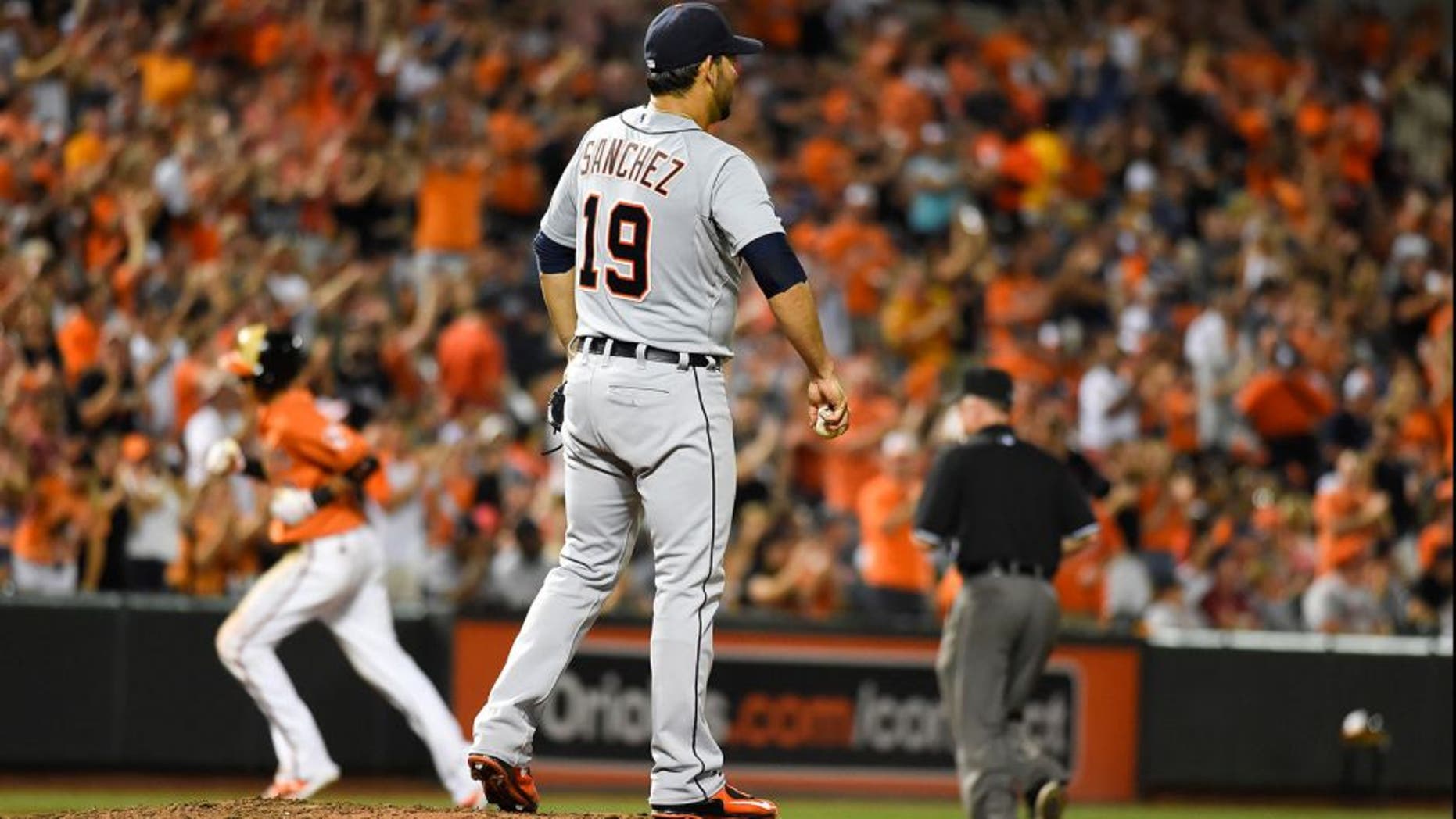 Aug 1, 2015; Baltimore, MD, USA; Detroit Tigers starting pitcher Anibal Sanchez (19) stands on the mound after giving up a two run home to Baltimore Orioles third baseman Manny Machado (13) during the seventh inning at Oriole Park at Camden Yards. Baltimore Orioles defeats Detroit Tigers 6-2. Mandatory Credit: Tommy Gilligan-USA TODAY Sports