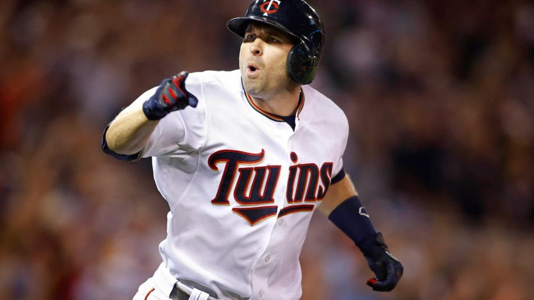 Jul 10, 2015; Minneapolis, MN, USA; Minnesota Twins second baseman Brian Dozier (2) celebrates his three run home run to win the game against the Detroit Tigers in the ninth inning at Target Field. The Twins win 8-6. Mandatory Credit: Bruce Kluckhohn-USA TODAY Sports
