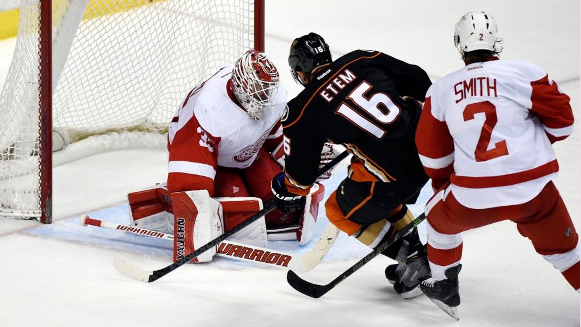 Feb 23, 2015; Anaheim, CA, USA; Anaheim Ducks right wing Emerson Etem (16) scores a goal past Detroit Red Wings goalie Jimmy Howard (35) and defenseman Brendan Smith (2) in the third period during the game at Honda Center. Mandatory Credit: Richard Mackson-USA TODAY Sports