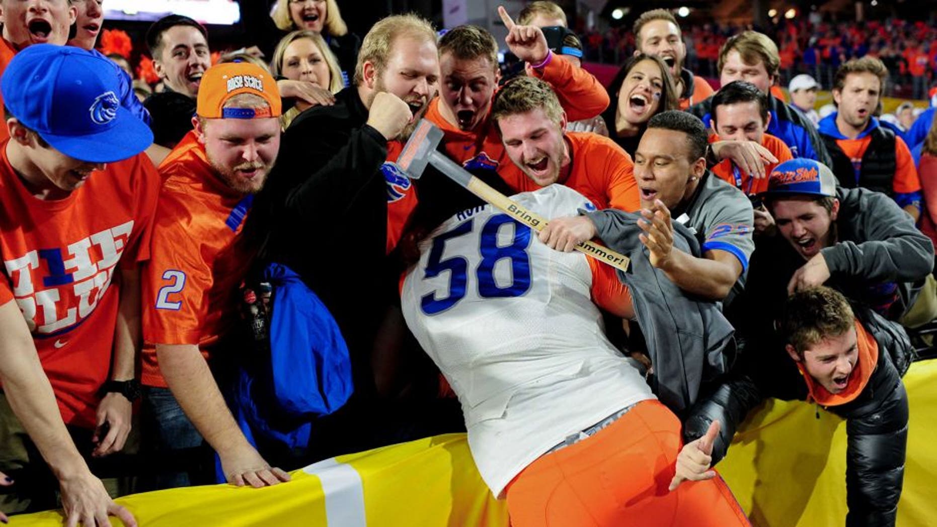 Dec 31, 2014; Glendale, AZ, USA;Boise State Broncos defensive tackle Robert Ash (58) celebrates after beating the Arizona Wildcats 38-30 in the 2014 Fiesta Bowl at Phoenix Stadium. Mandatory Credit: Matt Kartozian-USA TODAY Sports