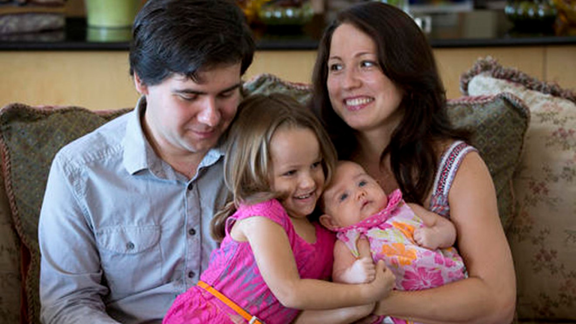 In this 2014 file photo, award-winning concert pianist Vadym Kholodenko, poses with his wife Sofya Tsygankova and daughters Nika, 4, and Michela, at their home in Fort Worth, Texas.