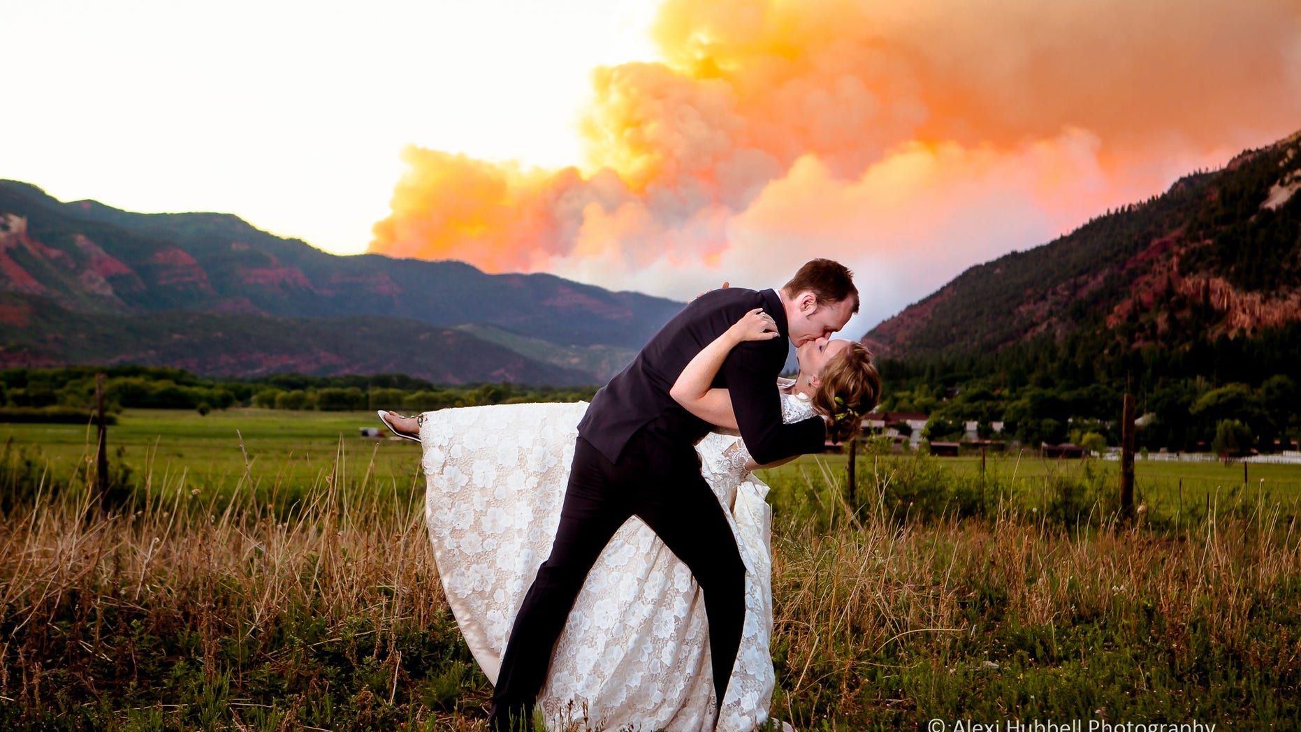 One couple's vivid wedding photo with Fire 416 in the background has gone viral on social media.