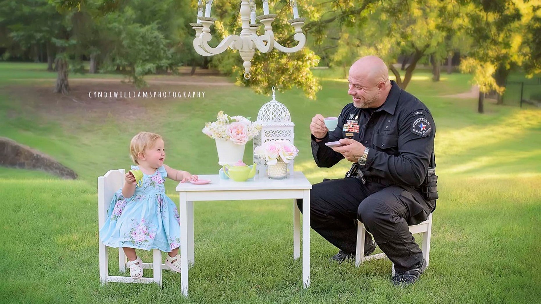 Evelyn Hall celebrated her first birthday with Deputy Constable Mark Diebold. (Cyndi Williams Photography)