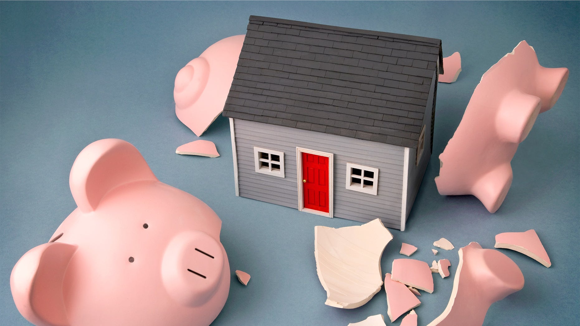 broken piggy bank with house inside