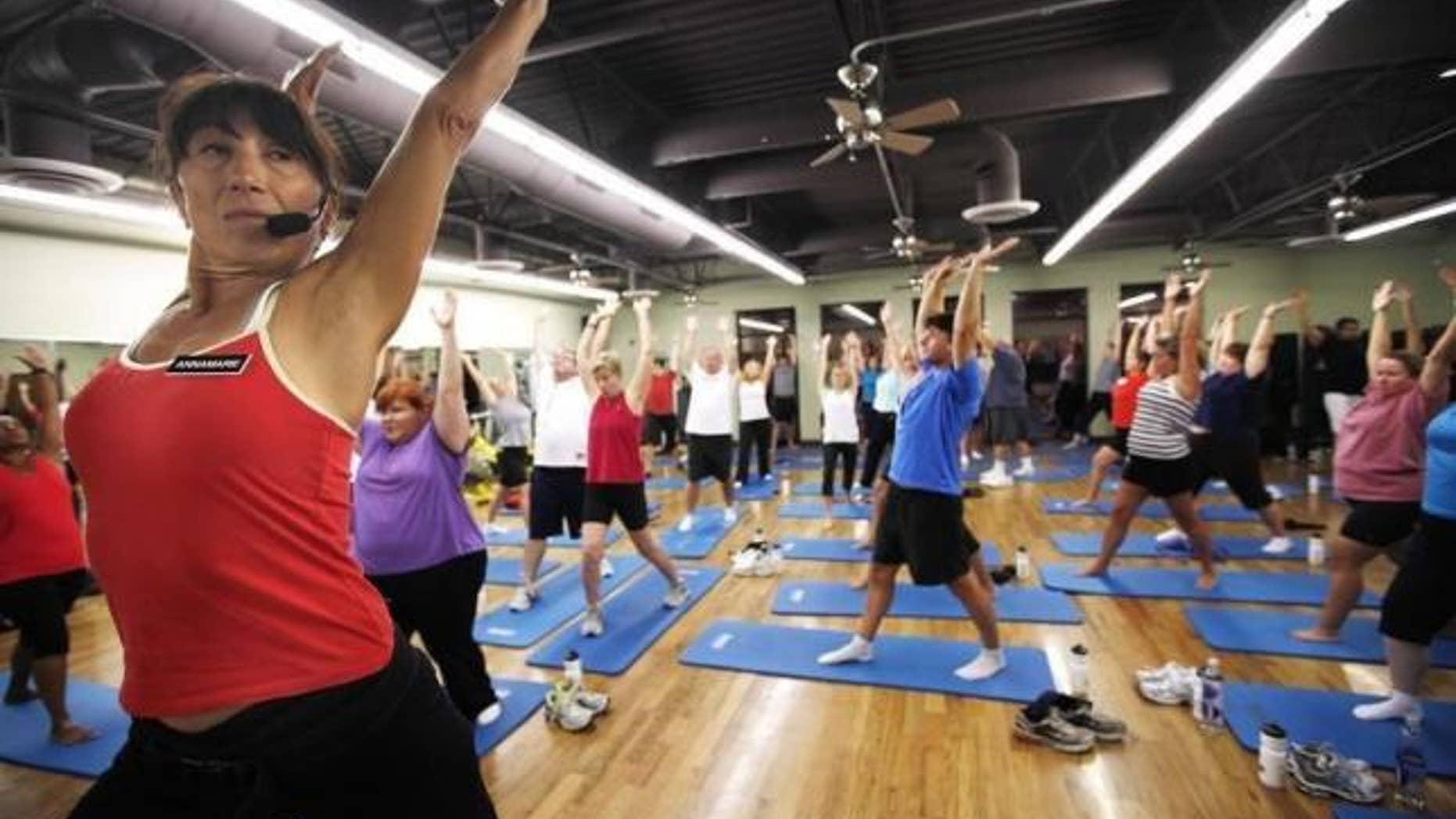 Trainer Anne Marie Smith (L) leads guests in a Pilates workout before dawn at the Biggest Loser Resort in Ivins, Utah September 6, 2010. REUTERS/Rick Wilking