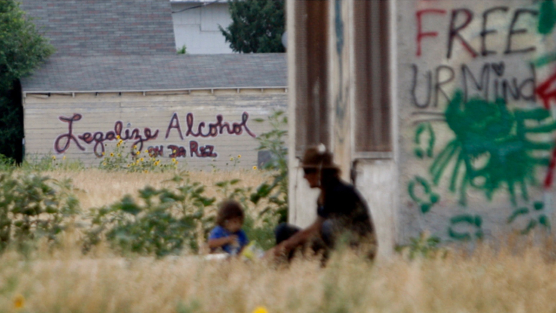 Aug. 13, 2013: Graffiti supporting the legalization of alcohol on the Pine Ridge Indian Reservation is painted on the side of a building in Whiteclay, Neb., indicates support for the legalization of alcohol on the Pine Ridge Indian Reservation,