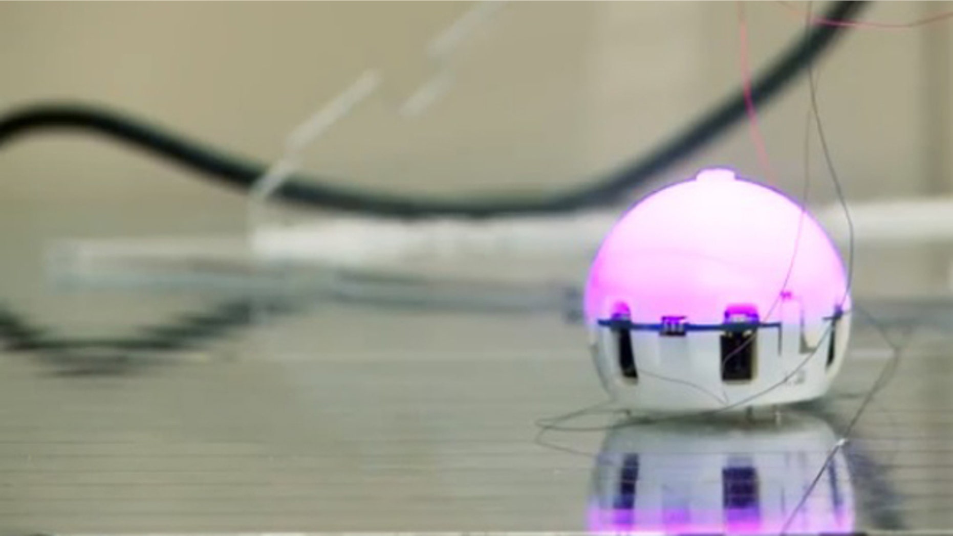 A ping-pong ball sized robot, designed to join with its mates and self-assemble.