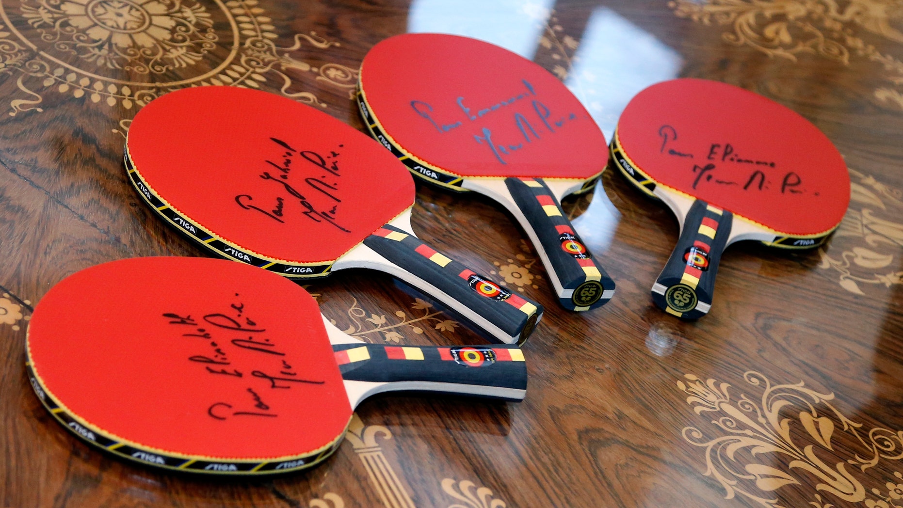 File photo - A set of bats offered to the children of King Philippe by former Belgian table tennis champion Jean-Michel Saive are pictured at Brussels' Royal Palace, Belgium, Jan. 5, 2016. (REUTERS/Francois Lenoir)