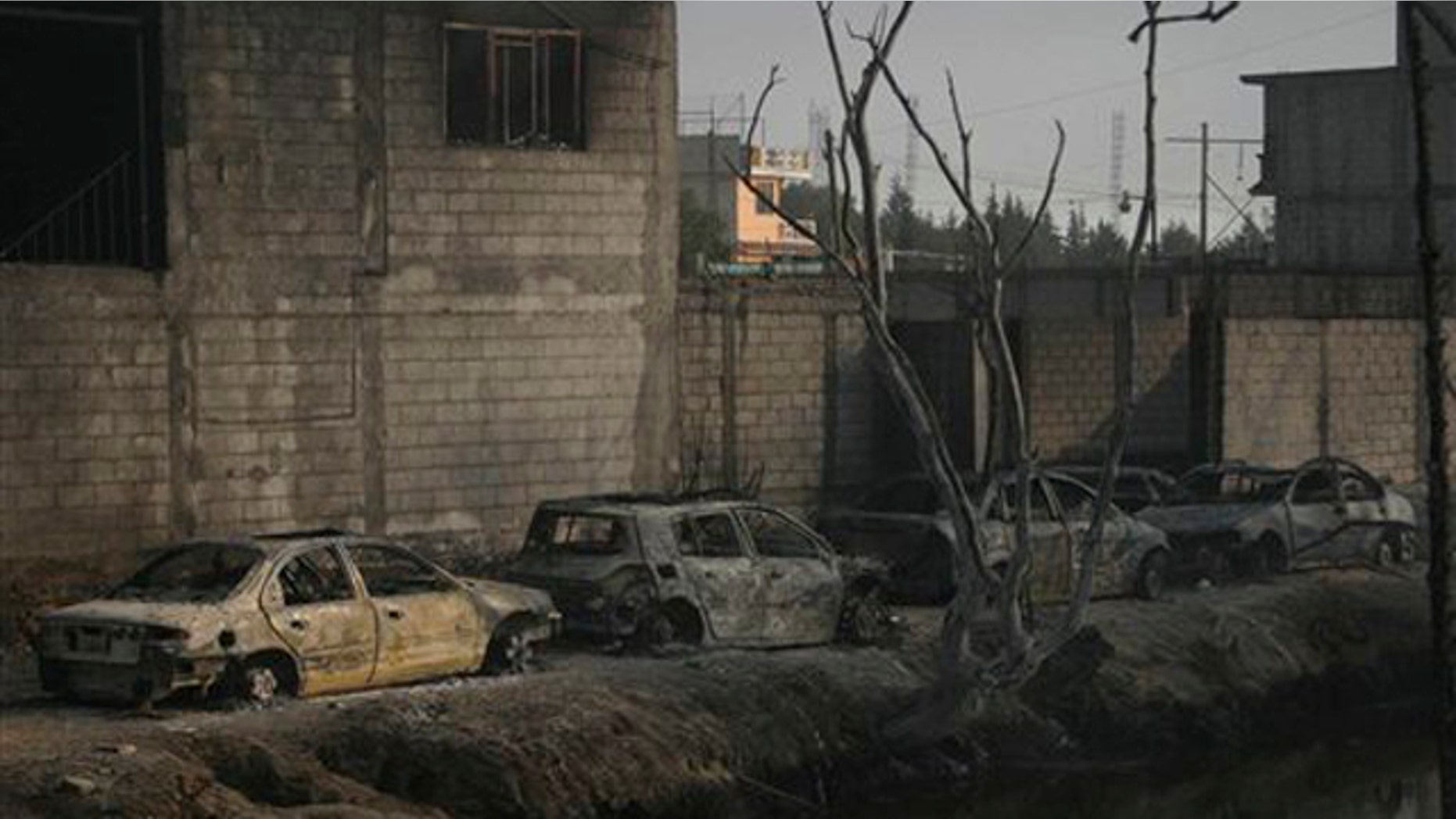 Dec. 19, 2010: Burned out cars and homes are lined up after a pipeline explosion in San Martin Texmelucan, Mexico. A pipeline operated by Mexico's state-owned oil company Petroleos Mexicanos, or PEMEX, exploded when thieves were attempting to steal either gas or oil, killing at least 27 people, authorities said.
