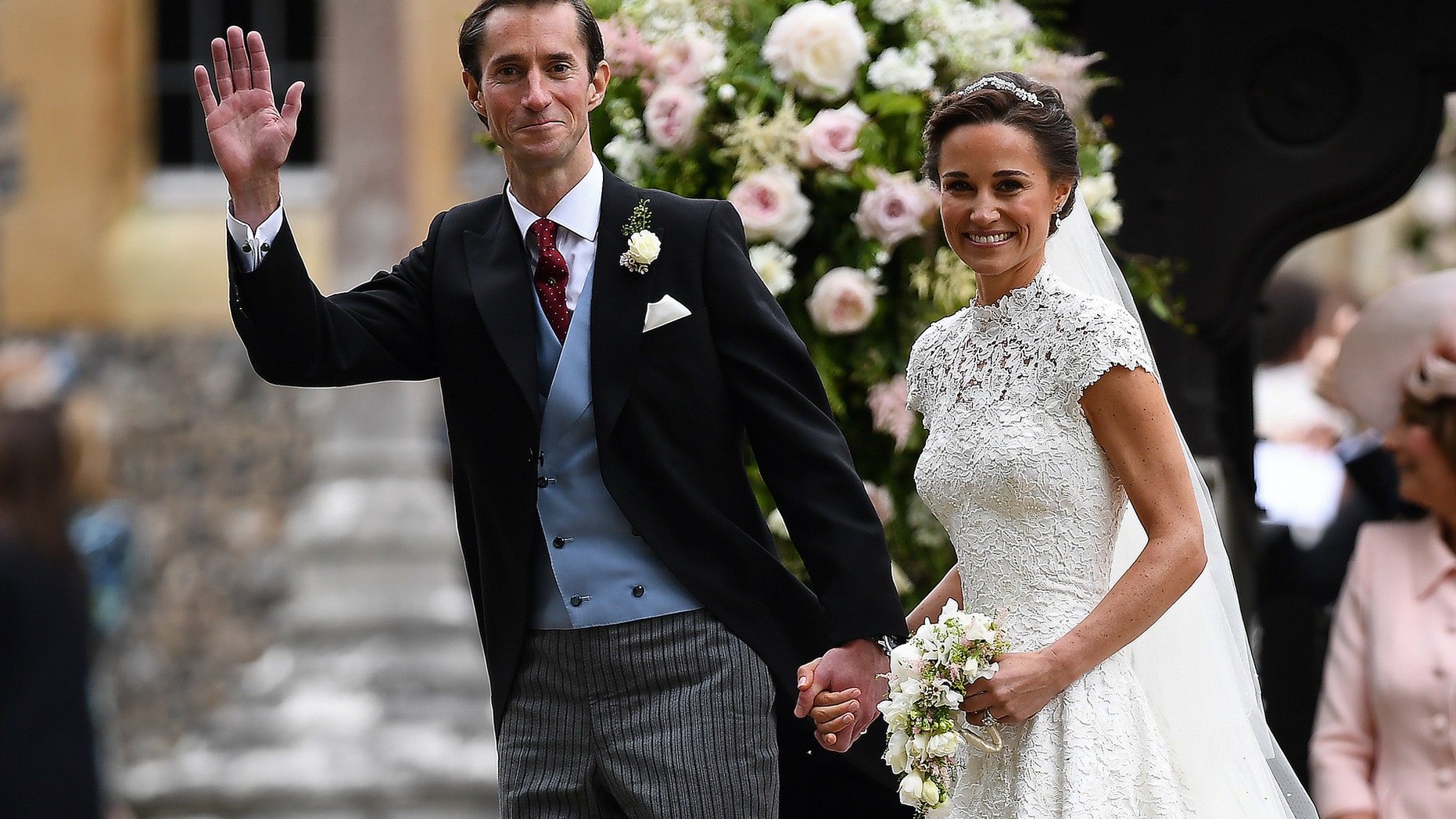 Pippa Middleton and her new husband, James Matthews, smile following their wedding ceremony at St Mark's Church in Englefield, west of London, on May 20, 2017.