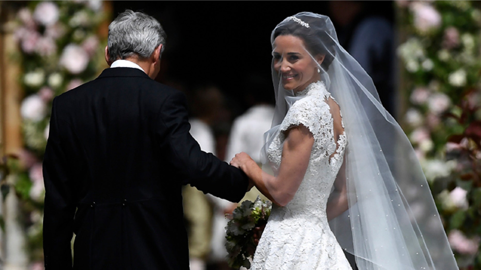 Pippa Middleton is escorted by her father Micheal Middleton as she arrives for her wedding.
