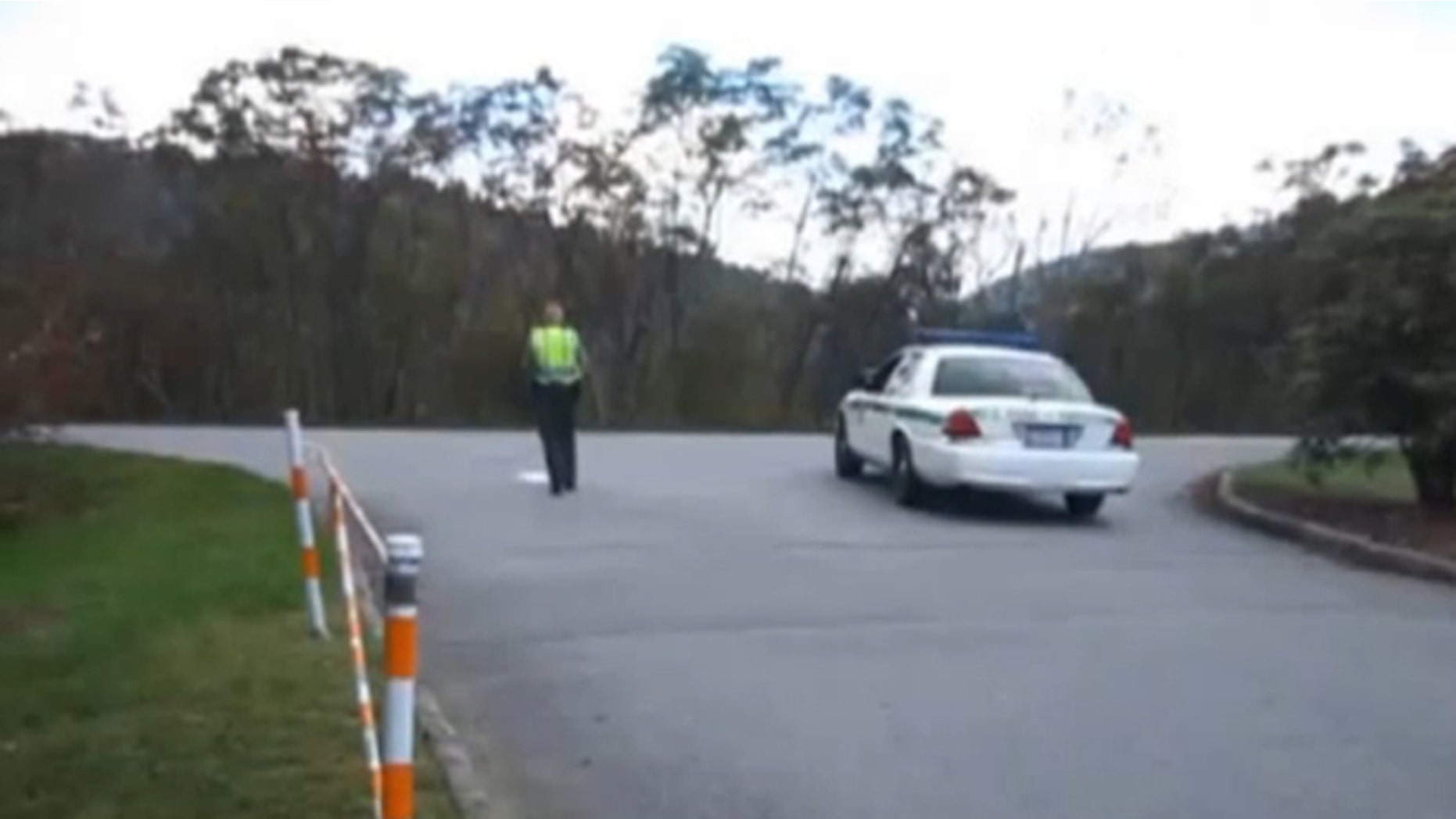 Shown here is an image, from video, of rangers blocking the parking lot to the Pisgah Inn in North Carolina.