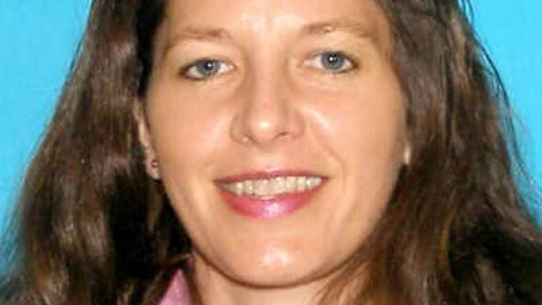 March 8, 2013: This undated image released by the Seattle police shows 46-year-old Carolyn Piksa, who authorities say is suspected of critically wounding a 65-year-old man in a Seattle parks department building. She was arrested at her home Friday, hours after fleeing the scene of the shooting. (AP/Seattle Police)