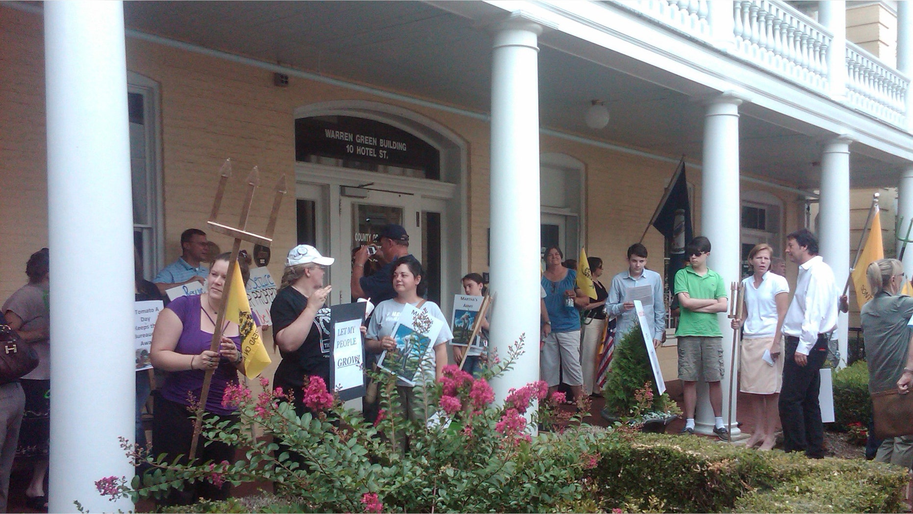 Farmers gather at a Board of Zoning Appeals meeting in Fauquier County Virginia to hold a "Pitchfork Protest" in support of Liberty Farms owner Martha Boneta.