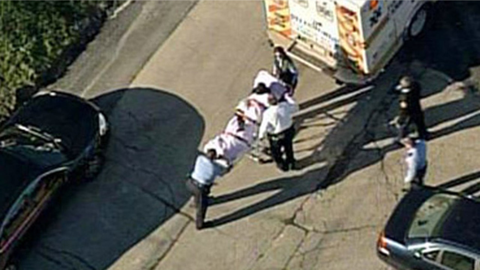 Nov. 13, 2013: In this aerial image provided by KDKA-TV, a person is loaded into an ambulance near Brashear High School in Pittsburgh.