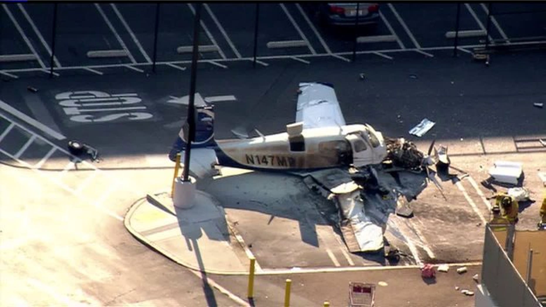 July 30, 2014: The wreckage of a small plane is shown in a Costco parking lot in San Diego. (Courtesy Fox5SanDiego.com)