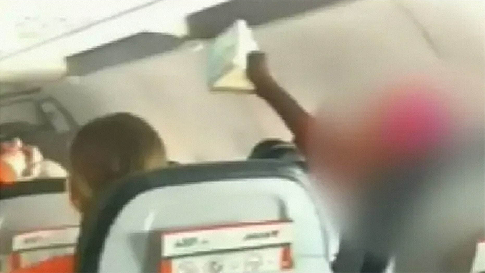 Witnesses told 9News that the woman began singing and chanting so loudly that children began to cry.
