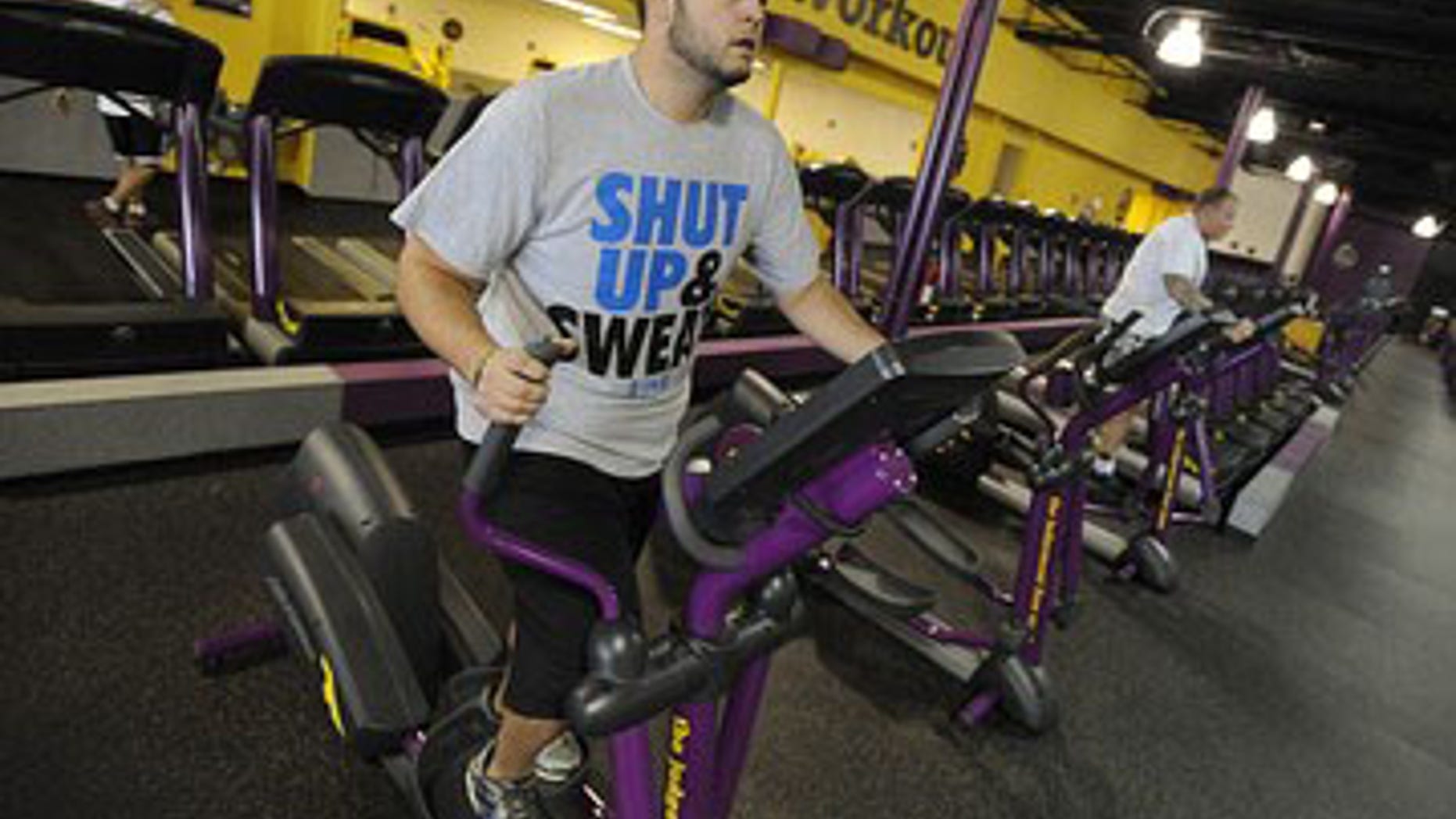 FILE: Nathan Montgomery, a contestant from the television show “The Biggest Loser” works out at a Planet Fitness in Colorado Springs, Colo.