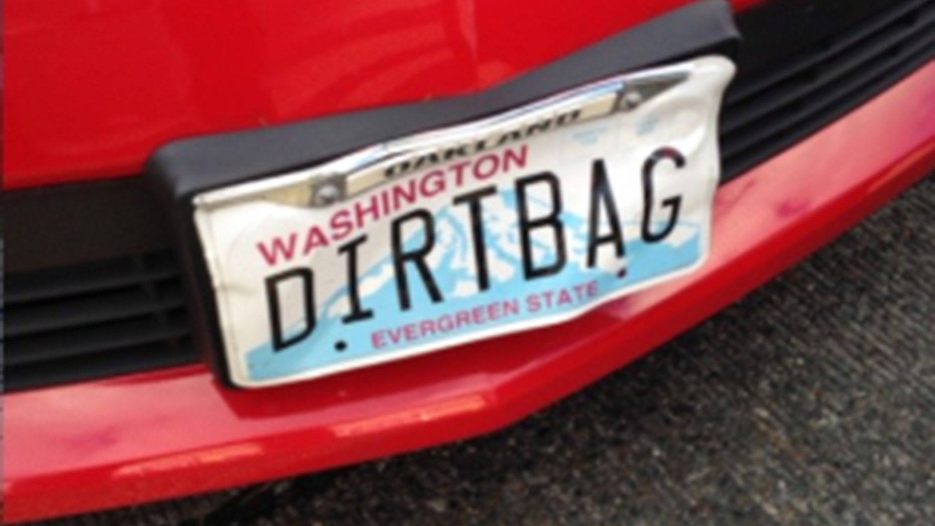 A man driving a Camaro with a license plate that read "DIRTBAG" was arrested in connection with a road rage incident.