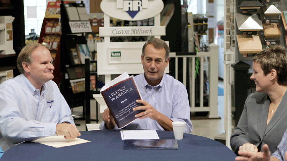 House Minority Leader John Boehner of Ohio, center, accompanied by Craig Fritsche, president of Tart Lumber, left, and Tabetha A. Baume-Chandler, president of Facility Technology of Sterling, Va., gather at Tart Lumber in Sterling, Va., Thursday, Sept. 23, 2010, to announce the Republicans "Pledge to America" agenda. (AP)