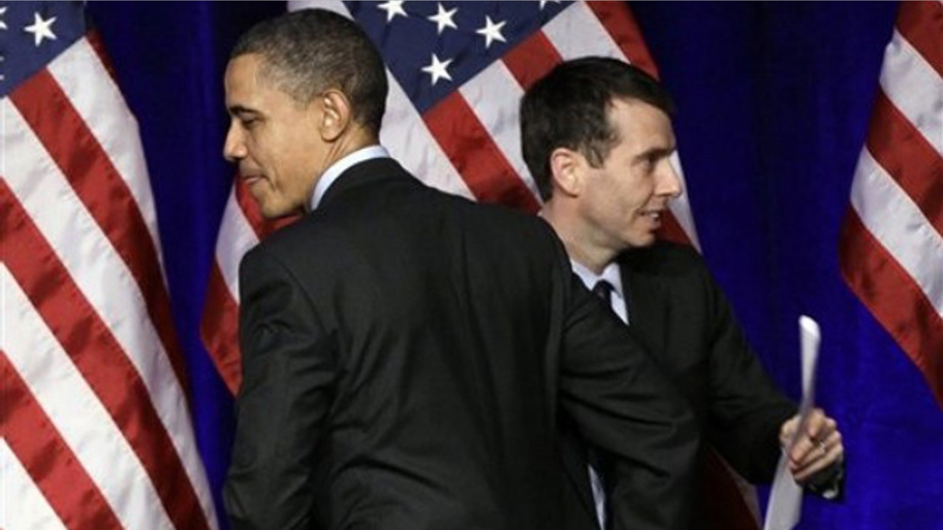 President Obama is introduced by senior adviser David Plouffe before he speaks at a Democratic National Committee event in Washington March 16.