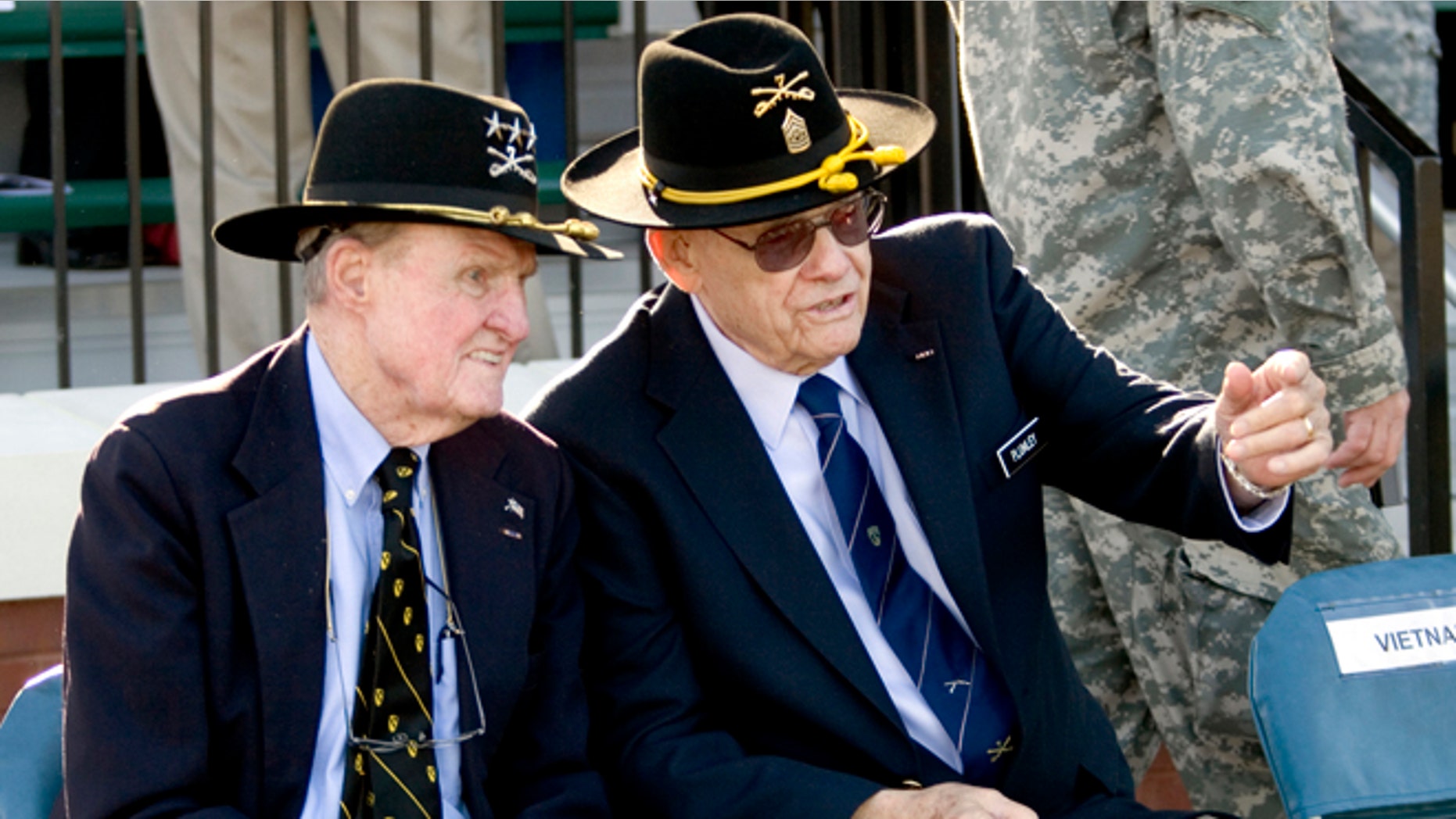 In a March 19, 2009 photo, retired Command Sgt. Maj. Basil L. Plumley, right, and retired Lt. Gen. Hal Moore, left, who served together with the 1st Cavalry Division in the Ia Drang Valley, talk at the National Infantry Museum and Soldier Center in Columbus, Ga.