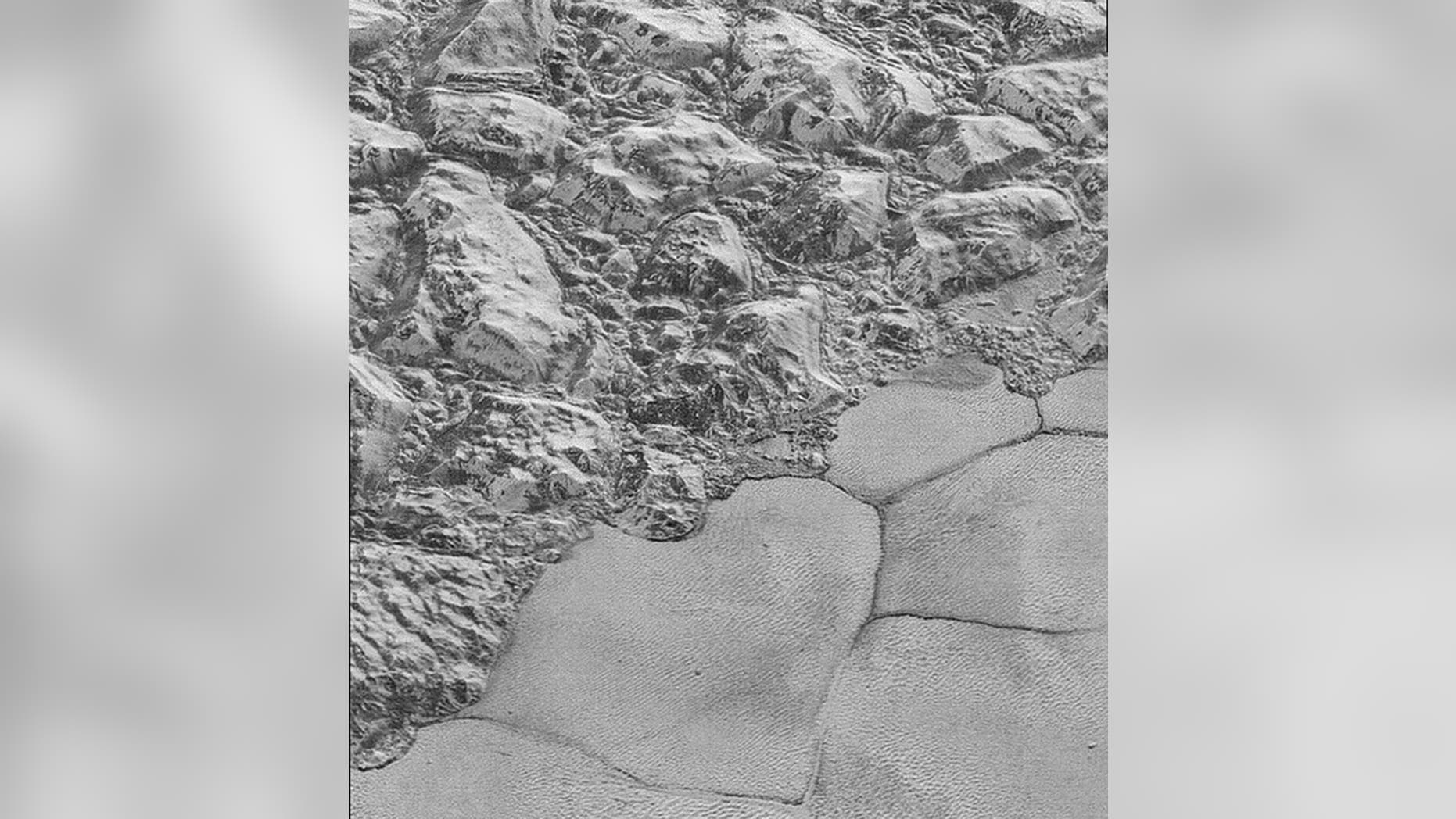 This image from NASA's New Horizons spacecraft shows sections of Pluto's water-ice crust (NASA)