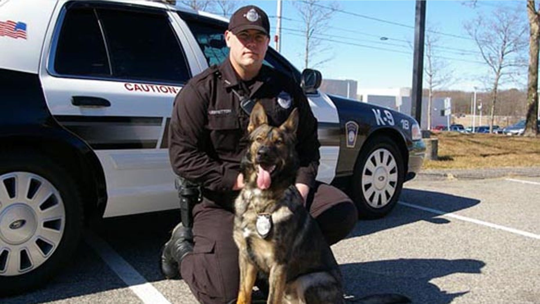 This photo shows police dog Kaiser, a member of Plymouth's K-9 team, pictured with a Plymouth police officer.