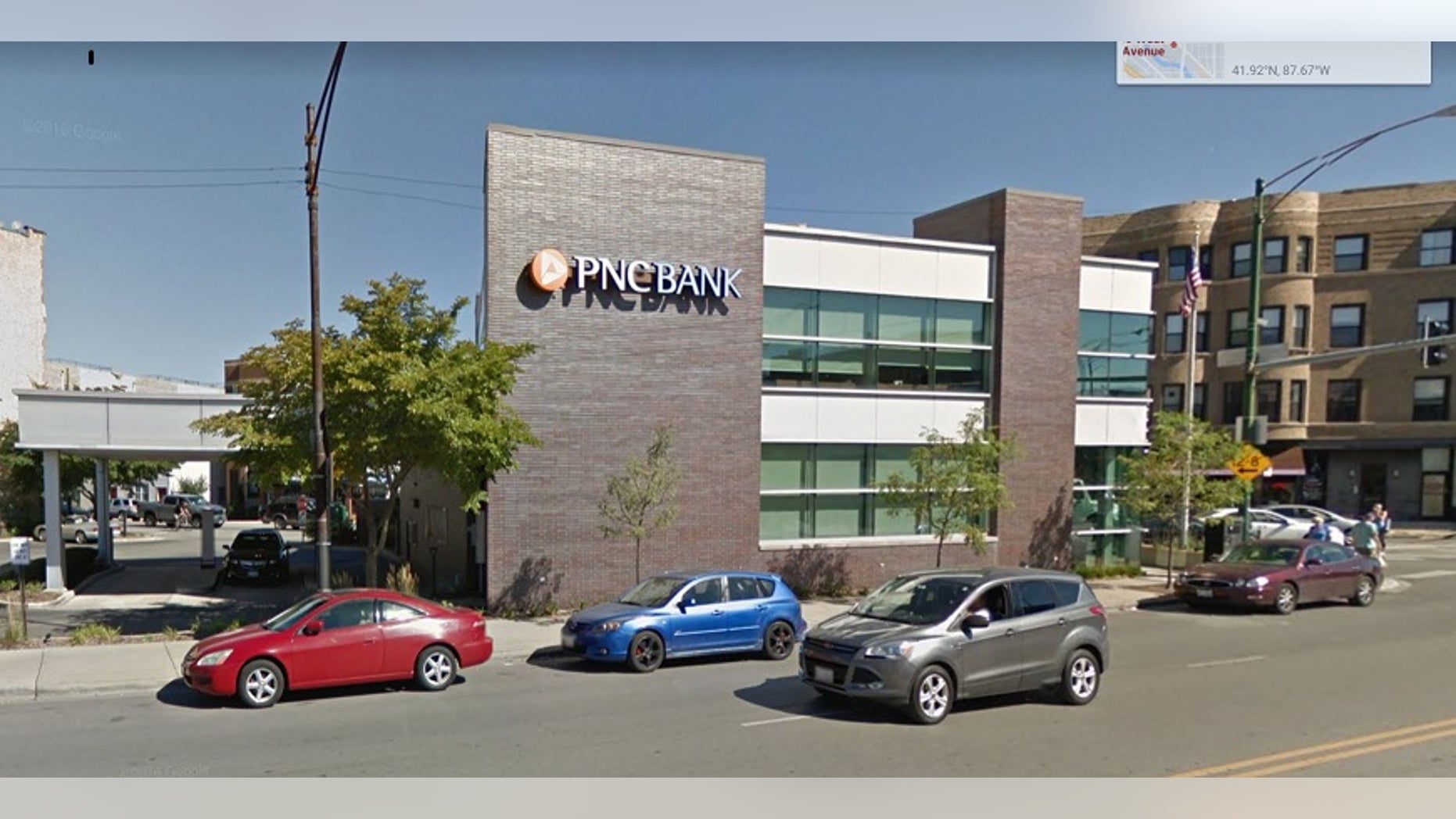 A Chicago woman died a few days after she was discovered unresponsive with her stuck in fence near a PNC Bank branch.
