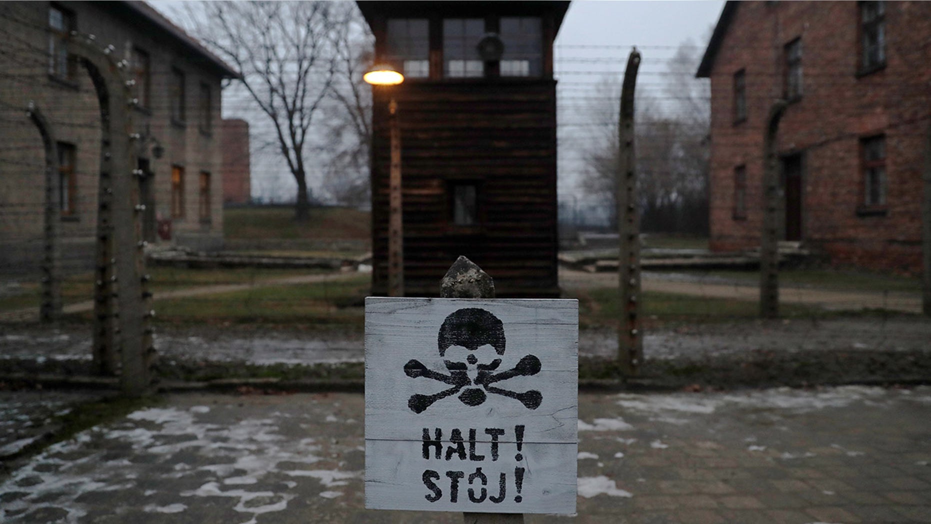 A sign reading "Stop!" in German and Polish is seen at the former Nazi German concentration and extermination camp Auschwitz.